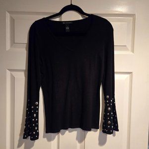 Black sweater top with silver studs detail. Sz. M